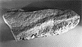 The Singapore Stone, a fragment of a sandstone block that once stood at the Singapore River mouth. It bears an inscription that has yet to be fully deciphered.