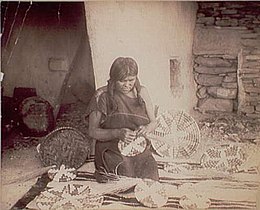 A Hopi basket weaver (1910).