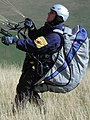 Starting paraglider pilot with harness