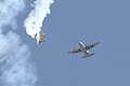 Mike Goulian doing some acrobatics below a C-130 at the Reno Air Show & Races