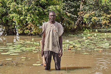 Abubakar Sule, 26, a farmer and butcher in Teshena, Bauchi state, northeast Nigeria who was expecting a bumpy harvest. Then one morning, he woke up to a farm swallowed by water. All his millet, corn, beans, sesame, and hard work were gone. More than half of his community had to seek shelter in schools converted into IDP camp Photographer : User: Sadiq Mustapha