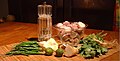 Ingredients for green curry: pepper, shallots, coriander and the coriander roots, galangal, shrimp paste, limes, garlic and green bird chillies.