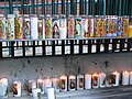 Votive candles next to the statue of Our Lady of Guadalupe outside the Cathedral