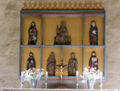 Altar piece from Heda kyrka in Sweden. Two figures at the center bottom are holding girdle books