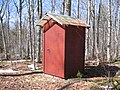 A red outhouse.