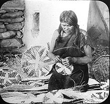 A Hopi basket weaver (1910).