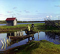 Two men with a boat