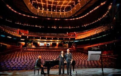 Israeli Opera soloists Anat Czarny and Oded Reich with conductor David Sebba singing arrangement of 'Bring Him Home' for the 220 hostages for World Opera Day (Courtesy Yosi Tzevker)