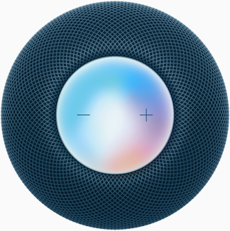 Vista desde arriba de un HomePod mini azul con los símbolos más y menos para regular el volumen sobre una pantalla multicolor.