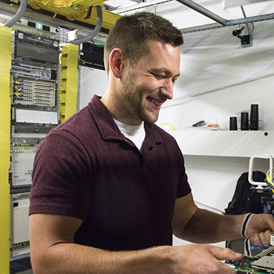 man repairing server