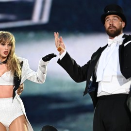 Taylor Swift is joined on stage by Travis Kelce (R), during "Taylor Swift | The Eras Tour" at Wembley Stadium on June 23, 2024 in London, England.