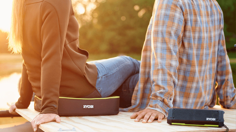 people sitting with Ryobi products