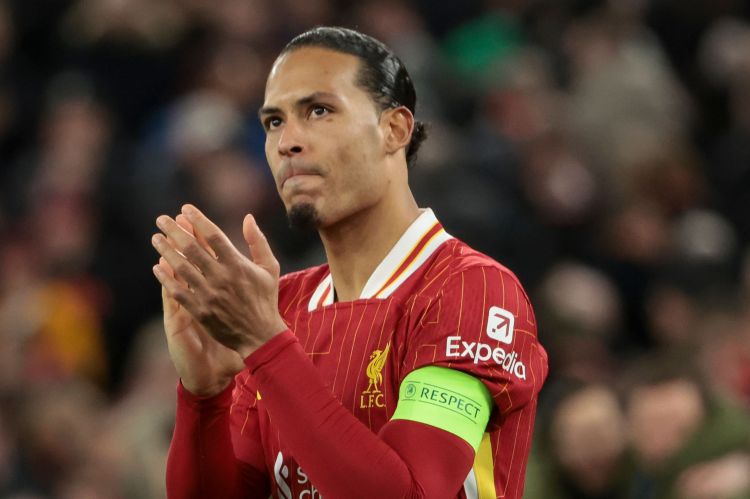 Virgil van Dijk of Liverpool applauding after a penalty shootout.