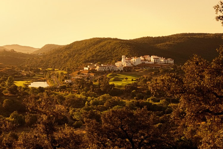 Hilltop resort nestled in a verdant landscape.