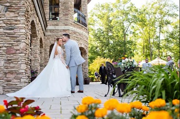 Bride and Groom posing on the Shenendoah Clubhouse Patio